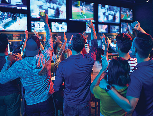 people in sports bar image